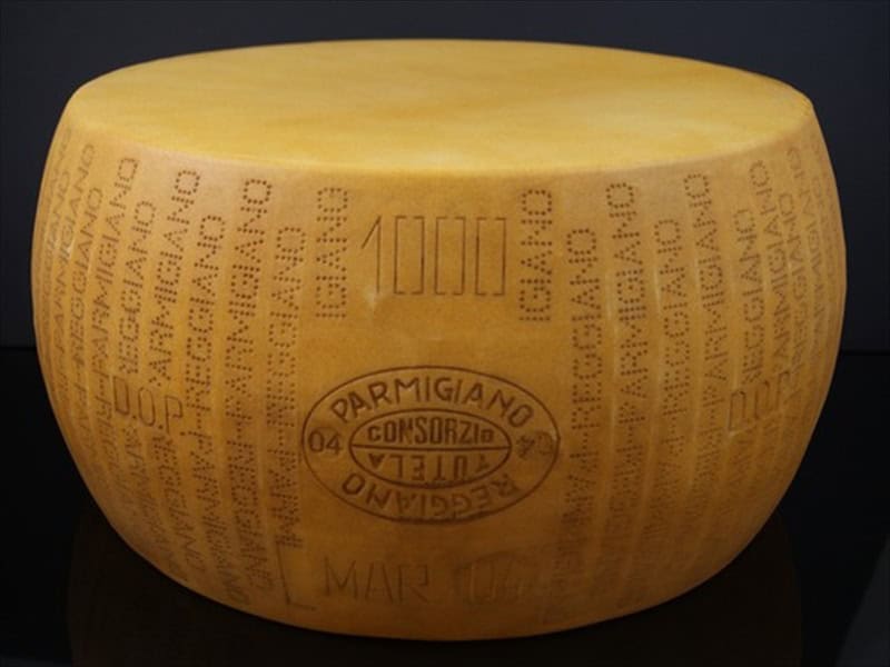 Cheese replica Parmesan Reggiano, with dish