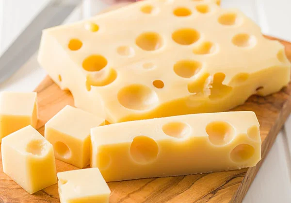 Pearl Valley Cheese factory in Ohio with fresh wheels of Swiss cheese on display