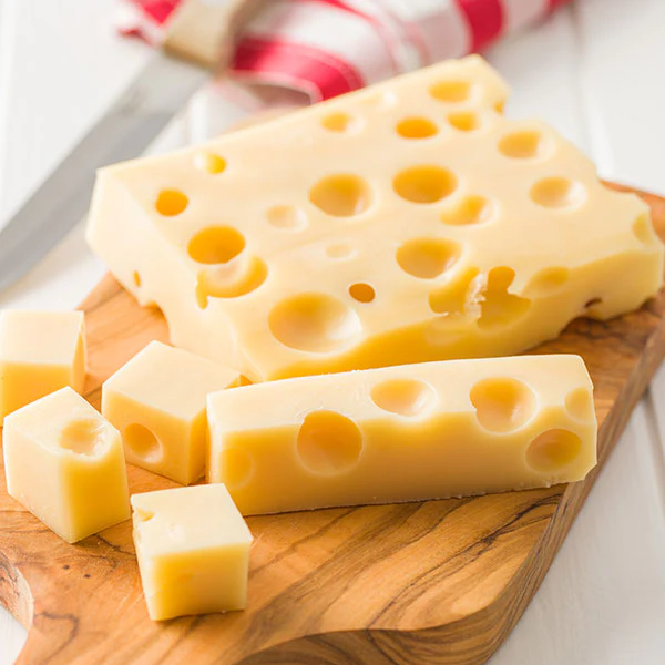 Pearl Valley Cheese factory in Ohio with fresh wheels of Swiss cheese on display