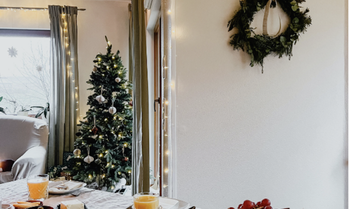 Wreath hanging on the wall near a Christmas spread