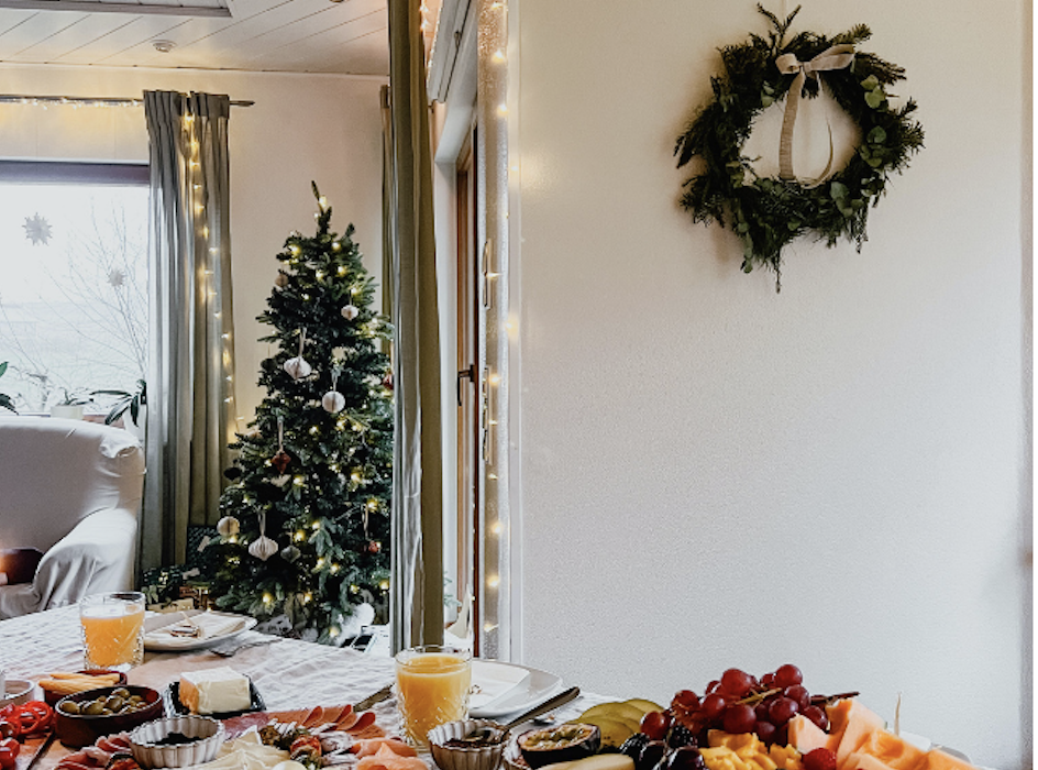 Wreath hanging on the wall near a Christmas spread