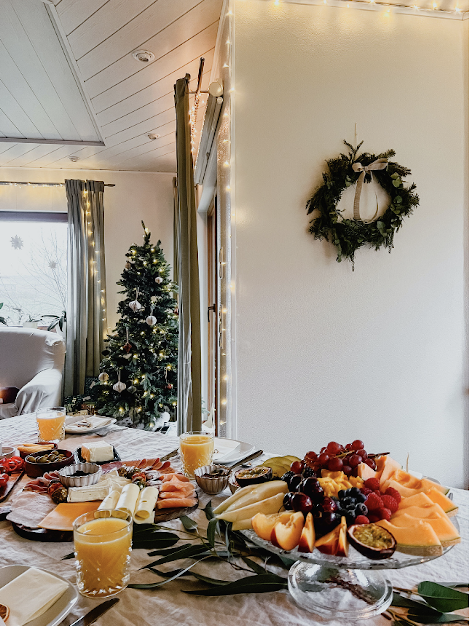 Wreath hanging on the wall near a Christmas spread